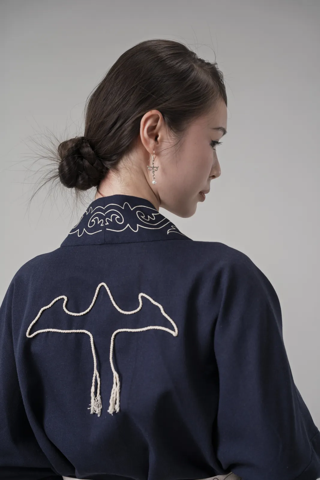 2026 - embroidered bird on navy