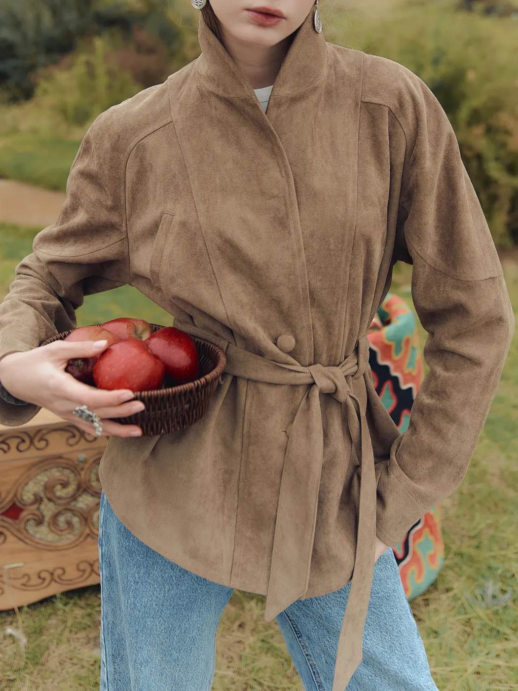 Suede belted jacket with traditional ornament