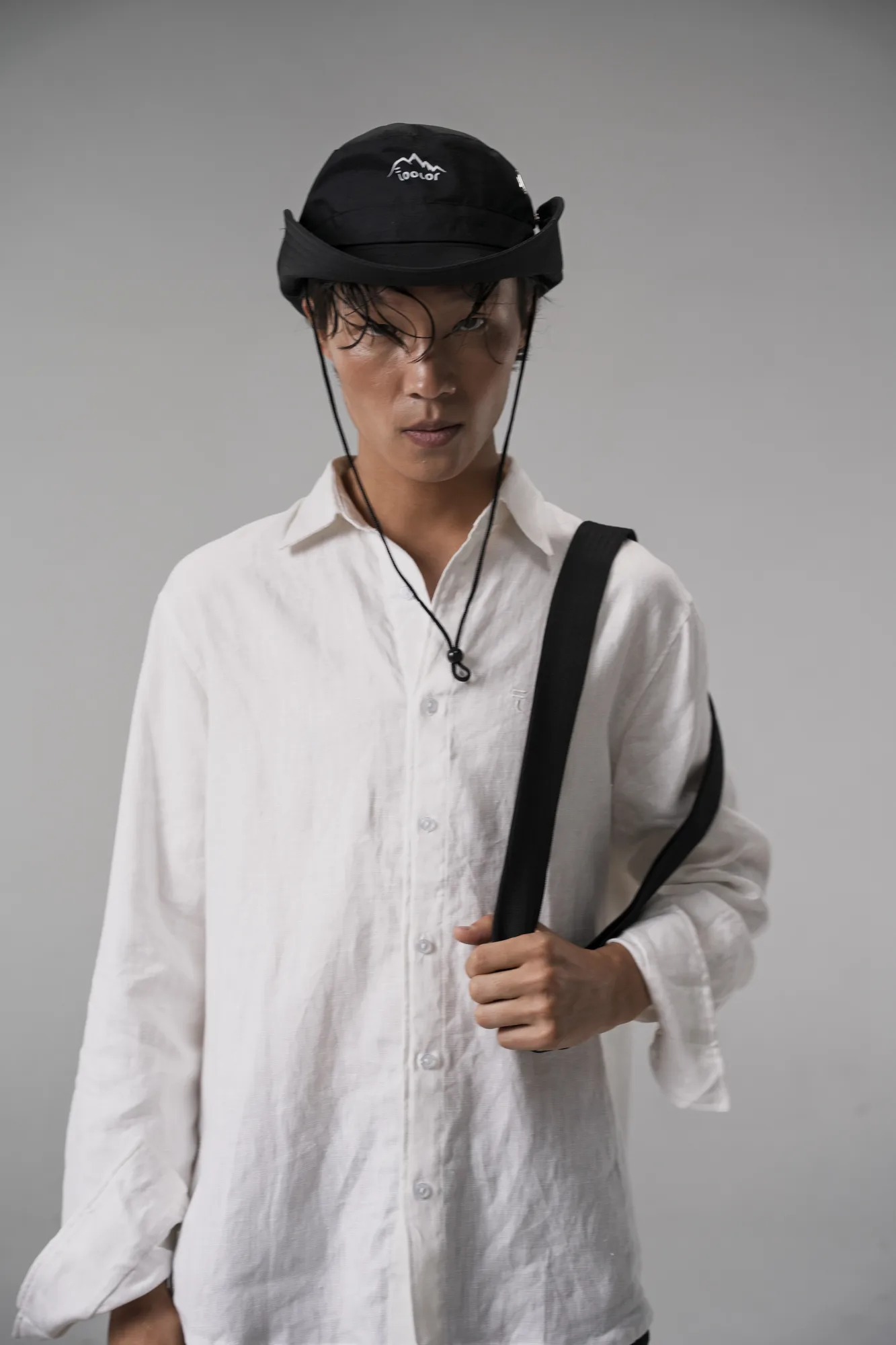 Toolor lookbook 2026 — white linen shirt and field hat